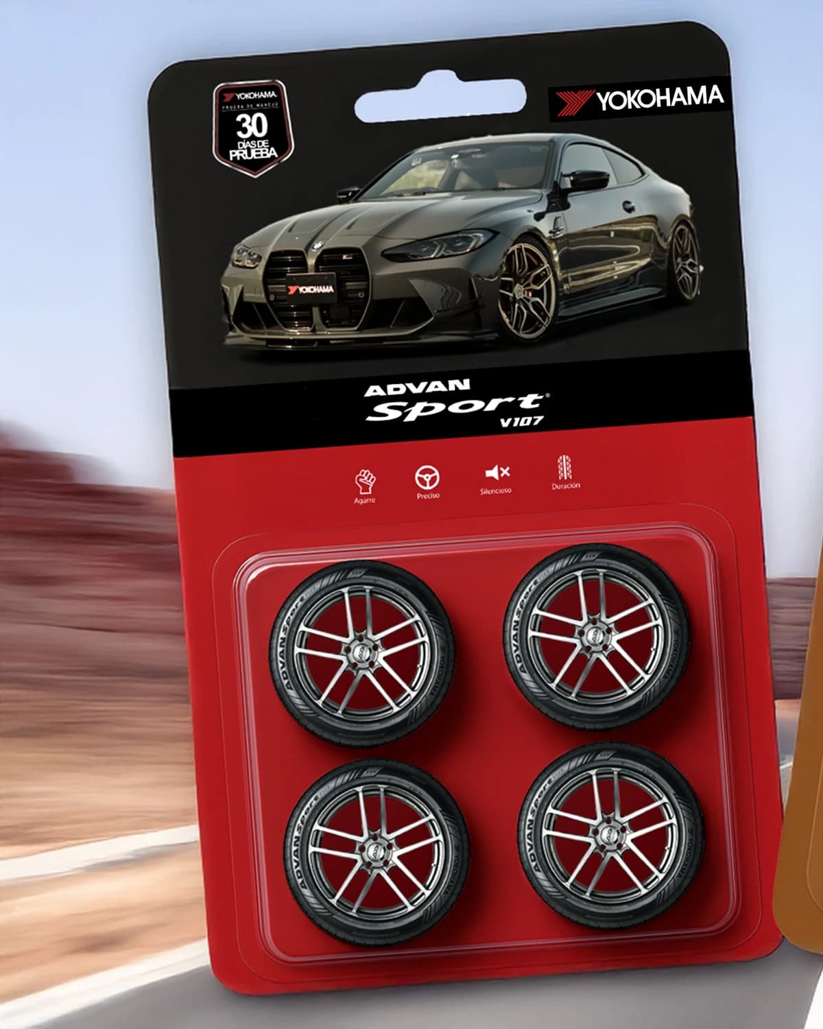 Diseño de Yokohama Advan Sport como un empaque coleccionable negro y rojo con automóvil y cuatro llantas